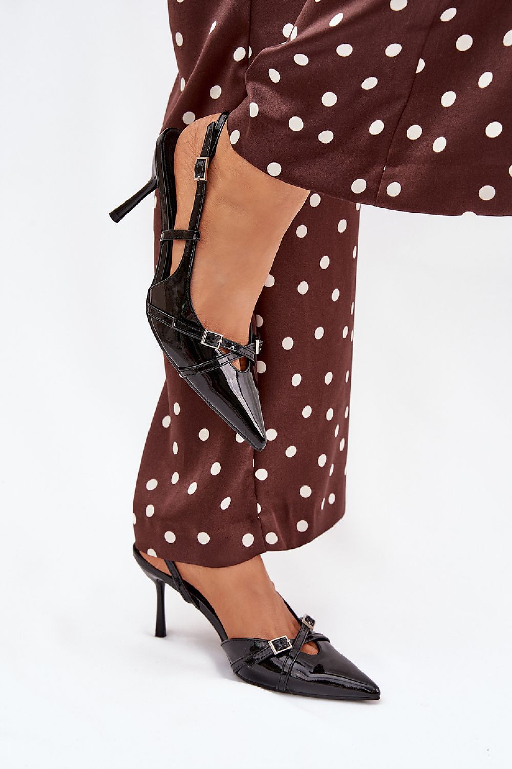 Close-up of Step in Style elegant stiletto heel pumps, highlighting decorative buckles and fine craftsmanship, ideal for evening events.