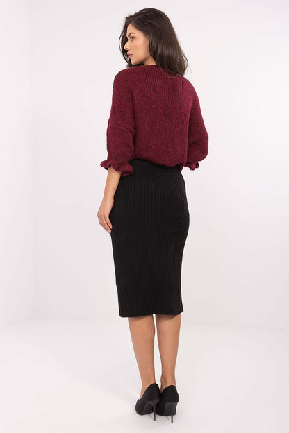 Versatile elegant look of the luxurious ribbed knit midi skirt by Sublevel, perfect for everyday styling and timeless fashion.