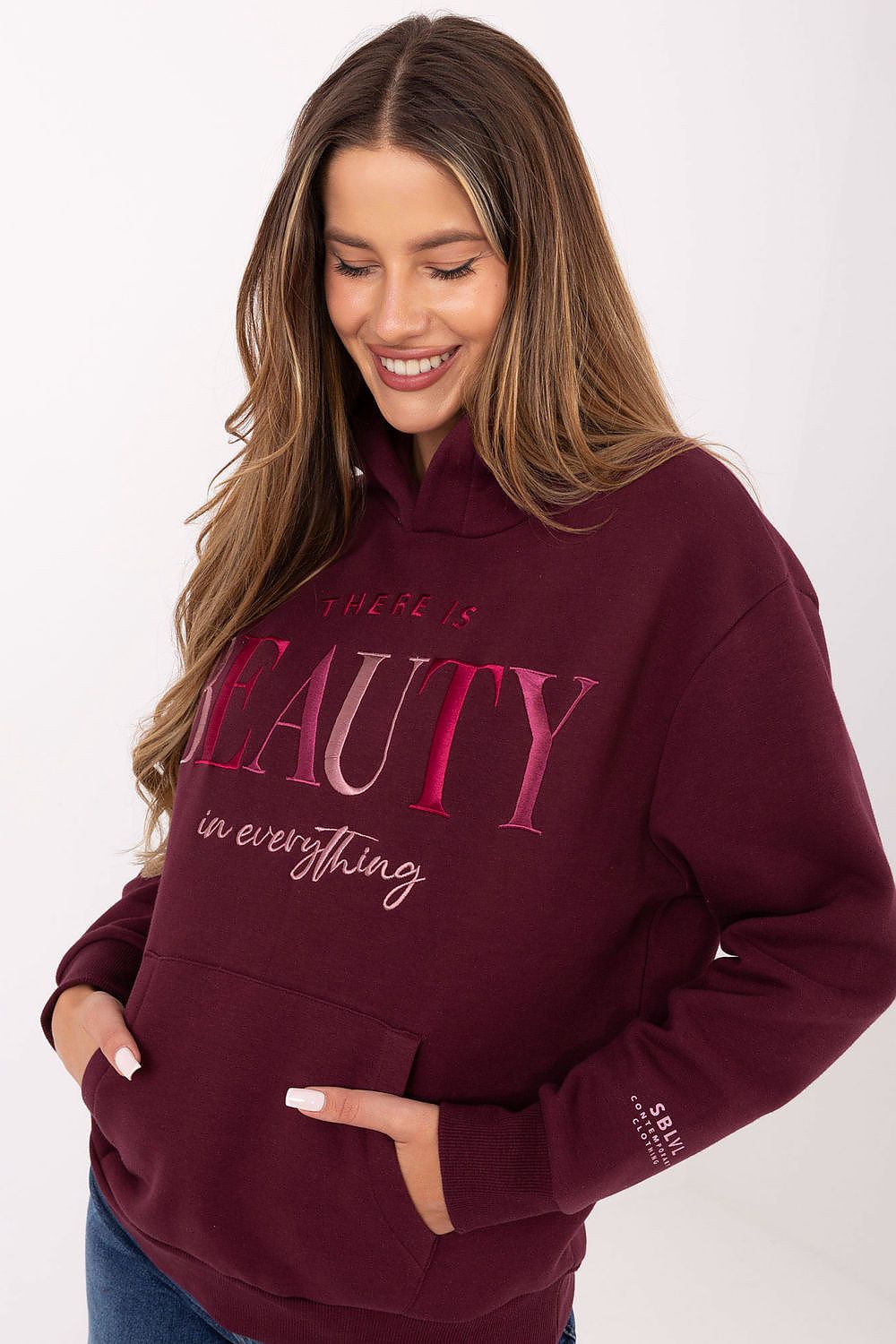 Chic Sublevel sweatshirt for women, perfect for everyday wear, combining luxury style with practical features like a kangaroo pocket.