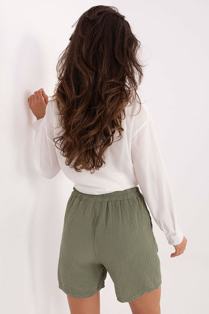Close-up of Italy Moda's stylish muslin shorts showcasing soft breathable cotton fabric, ideal for a chic and casual summer look.