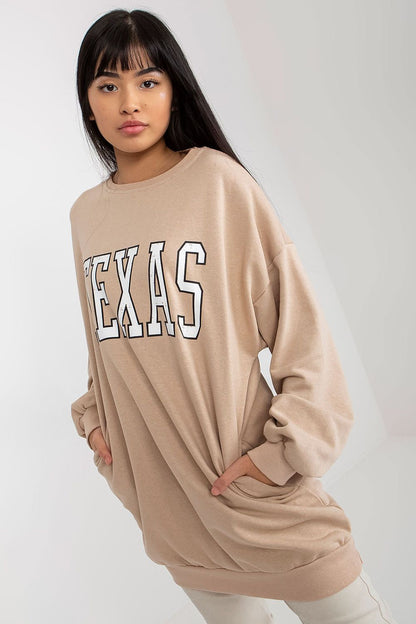 Ex Moda stylish women's long casual sweatshirt in soft cotton-polyester blend, showcasing practical front pockets and modern inscription, perfect for everyday luxury wear.