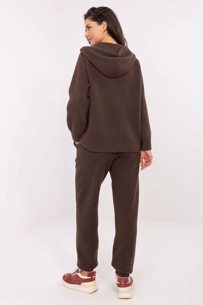 Model showcasing MBM's luxury women's wool-blend casual set, featuring a hood, pockets, and tailored fit, emphasizing versatile chic for everyday wear.