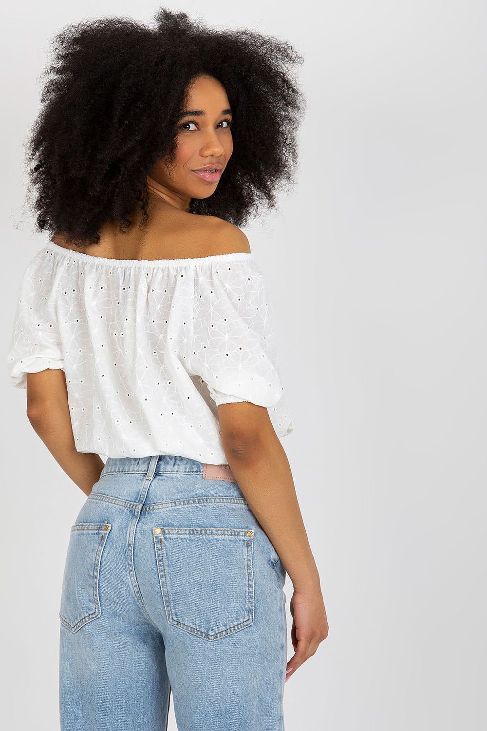 Stylish close-up of Lakerta off-the-shoulder boho blouse detailing the delicate lace and button accents, perfect for casual outings.