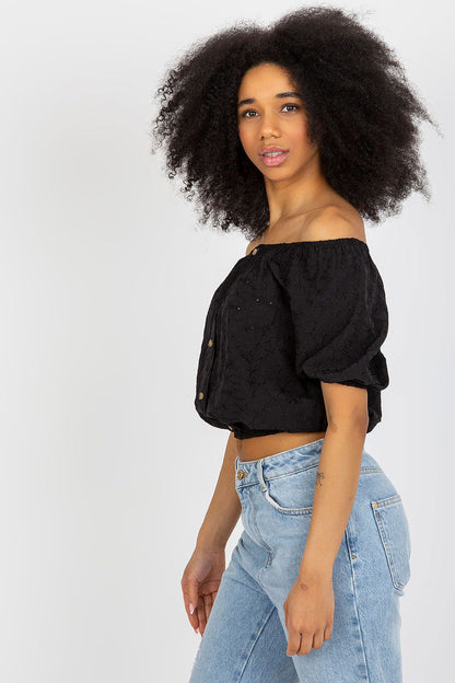 Luxurious Lakerta boho blouse showcasing a sensual neckline and decorative buttons, crafted for comfort and style in summer.