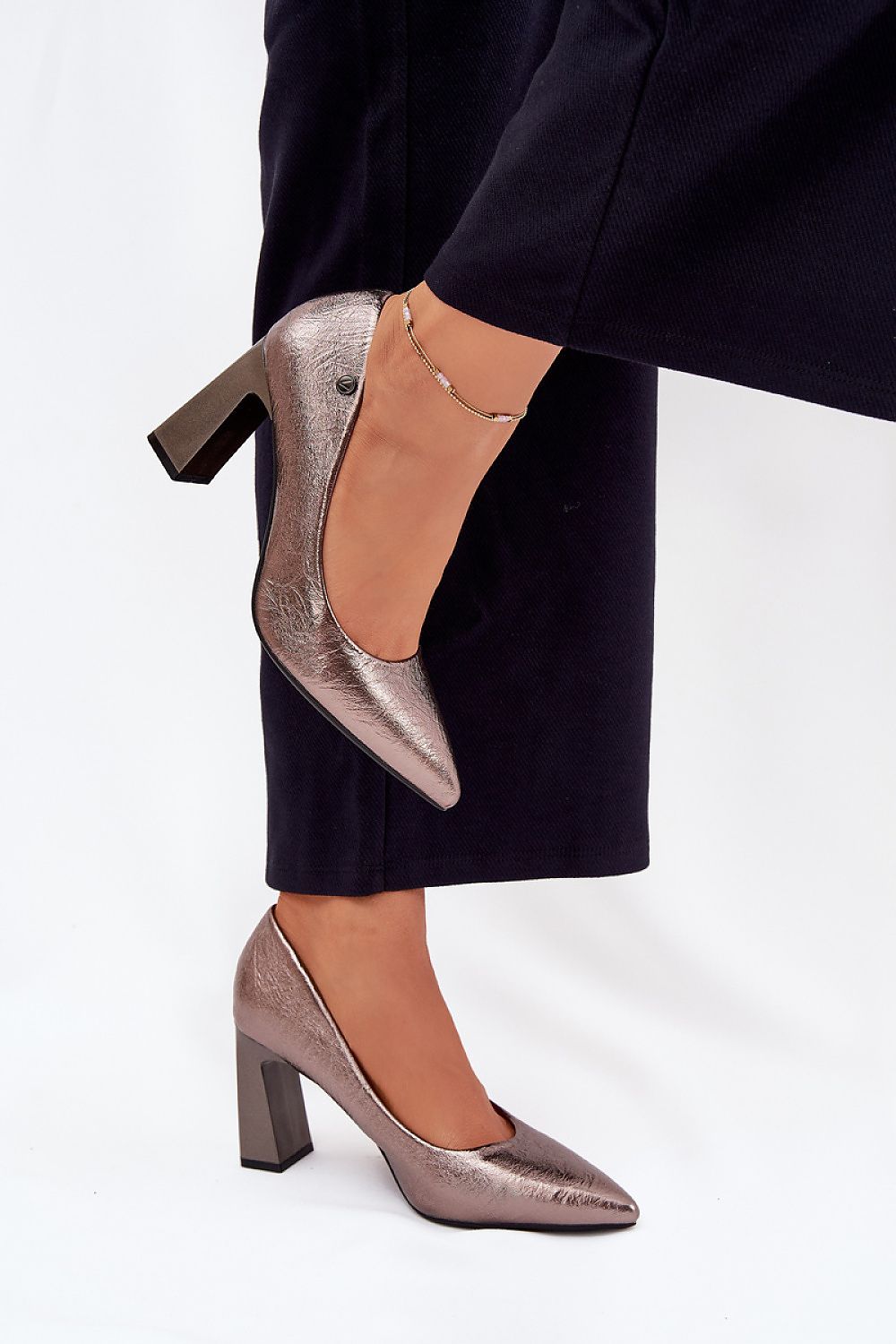A pair of elegant women's block heel pumps by Step in Style, designed to enhance any outfit effortlessly with grace.