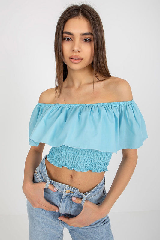 Lakerta boho chic sleeveless blouse in soft cotton, featuring an off-the-shoulder neckline with a wide frill, perfect for a luxurious summer outfit.