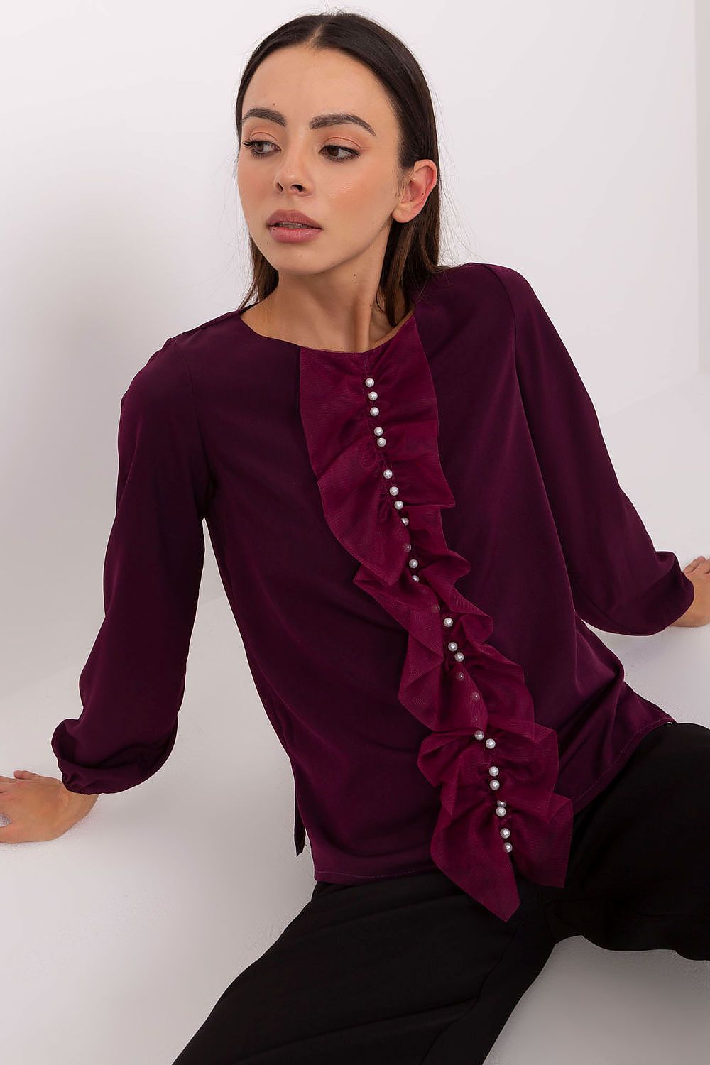Elegant Lakerta blouse featuring vertical ruffles and intricate bead detailing, designed for a refined look. Perfect for formal occasions, available in sizes EU 36-42 | US 4-10.