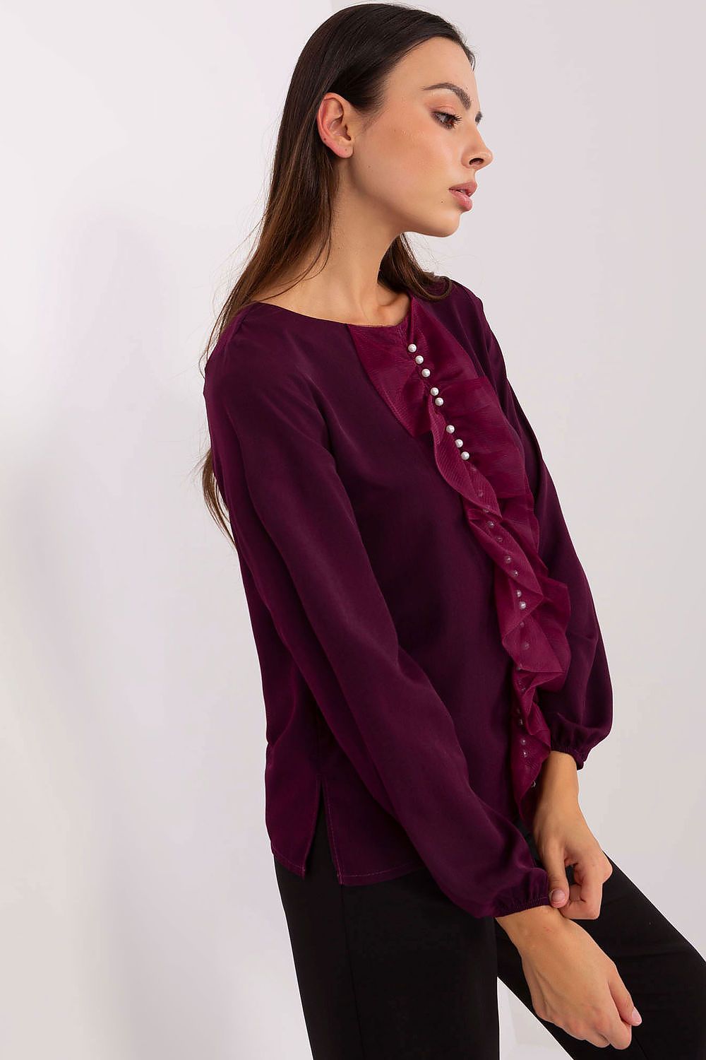 Elegant Lakerta blouse featuring a vertical ruffle adorned with beads, exuding luxury and sophistication, available in EU sizes 36-42.