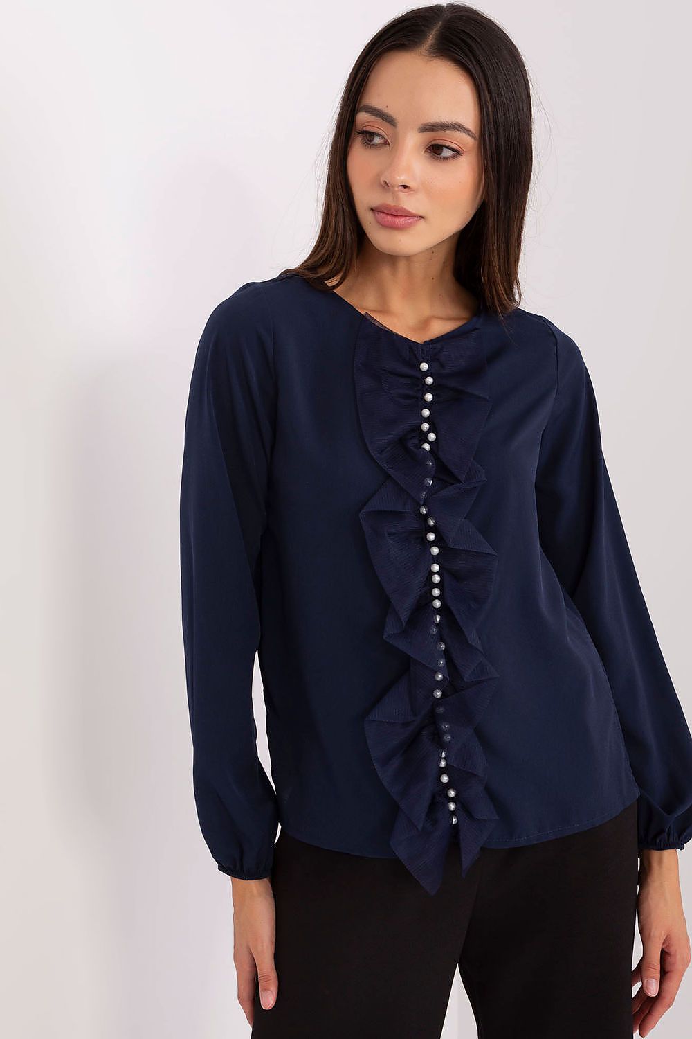 Stylish Lakerta blouse displayed on a mannequin, highlighting the classic round neckline and long sleeves, perfect for formal occasions.