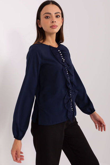 Elegant Lakerta blouse styled with a pair of tailored trousers, illustrating versatility for work and formal meetings, made from high-quality materials.