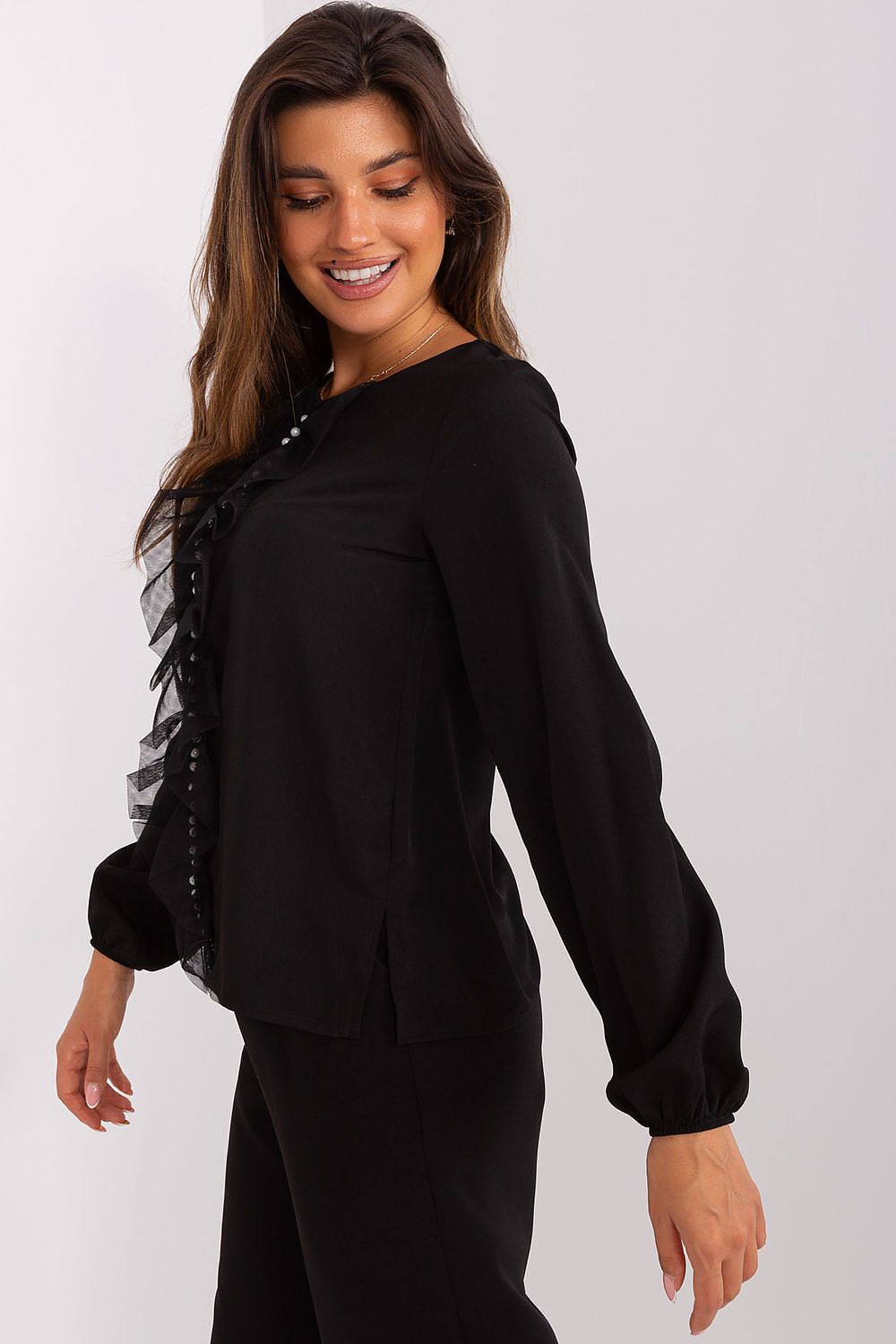 Stylish Lakerta blouse showcasing intricate beaded detailing and chic vertical ruffles for an elegant appearance.