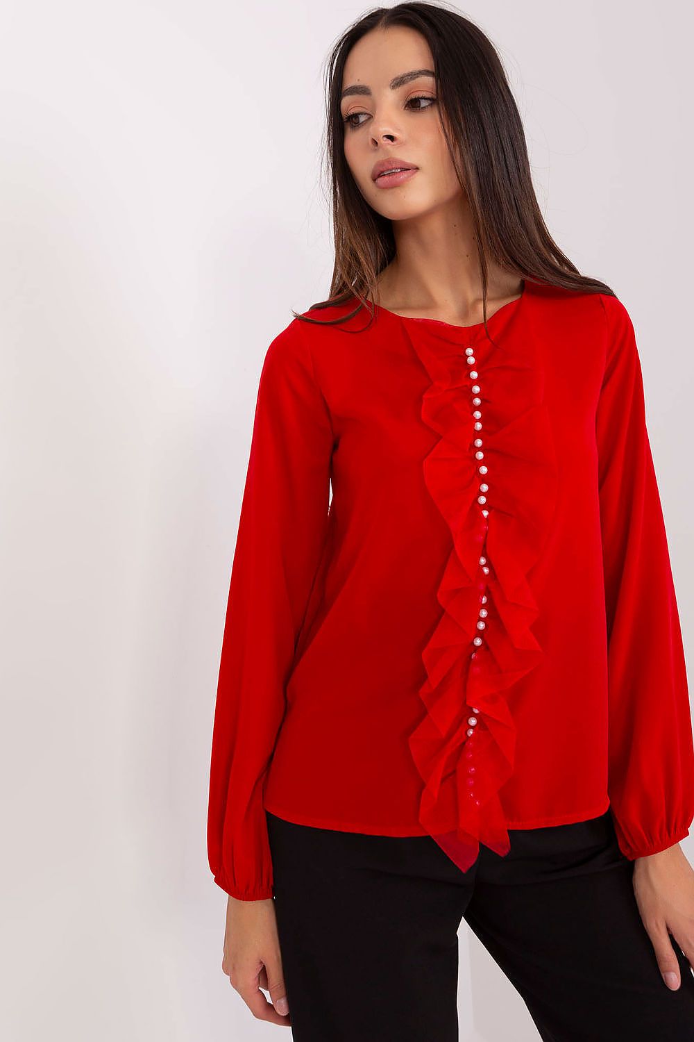 Luxurious Lakerta blouse with smooth fabric and classic round neckline, perfect for formal settings.