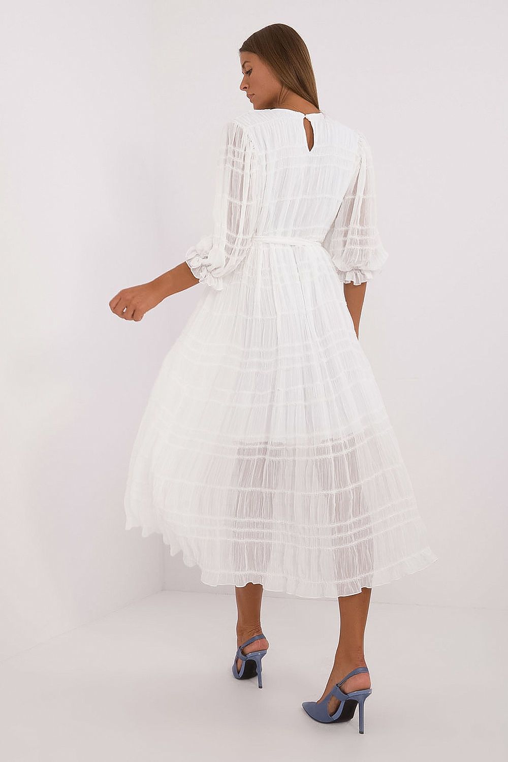 Model wearing Lakerta's elegant midi flared cocktail dress, highlighting the flattering belt at the waist and the comfortable, stylish design.