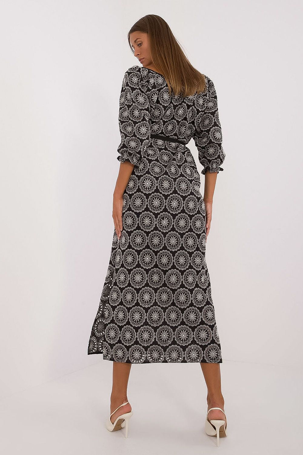 Beautiful Lakerta midi dress with a stylish side slit and luxurious lace pattern, designed for comfort and elegance.
