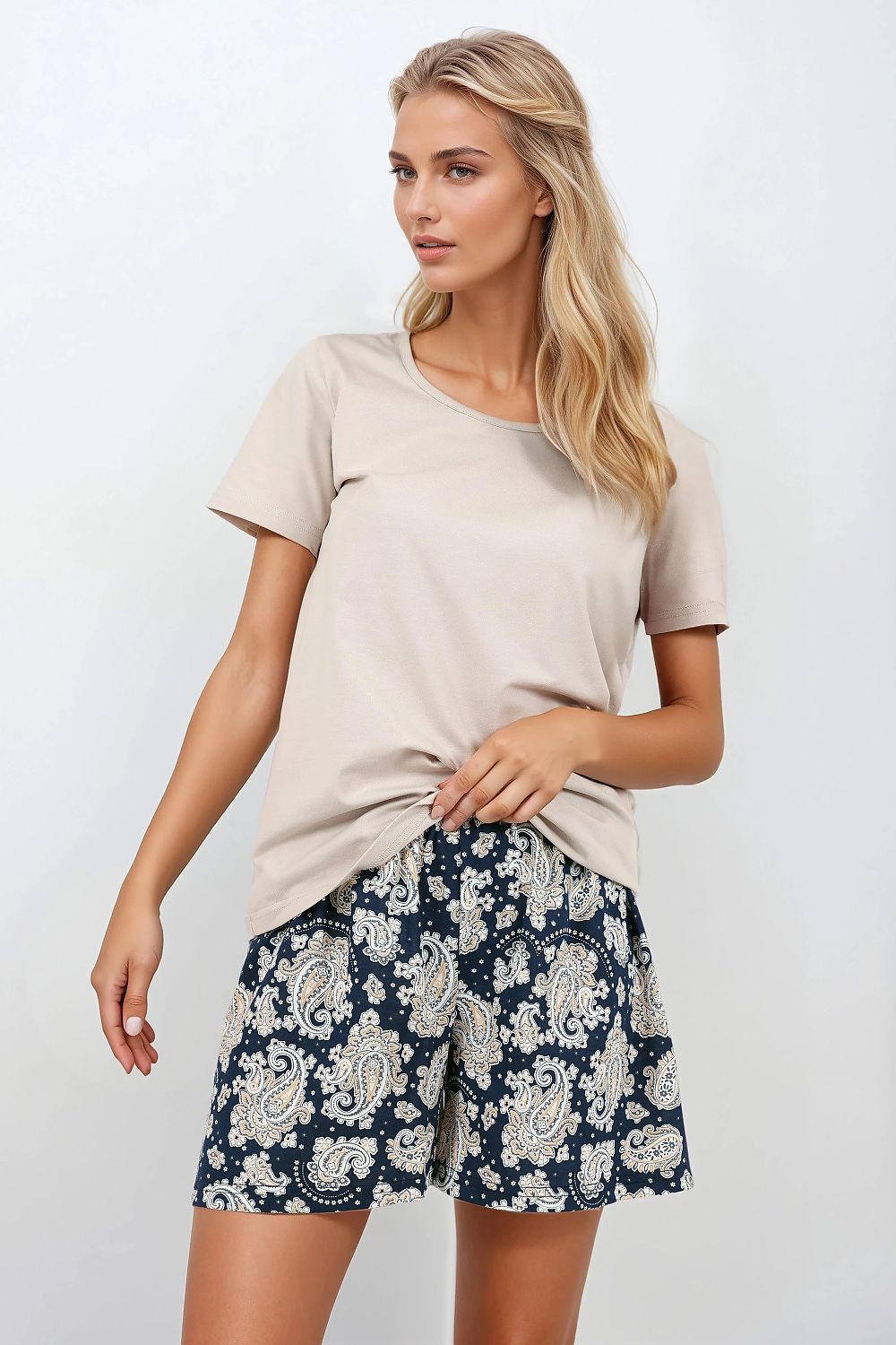 Elegant Luxury Women's OEKO-TEX Certified Pyjama Set by Momenti Per Me featuring a stylish loose top and chic shorts, designed for comfort and aesthetics.