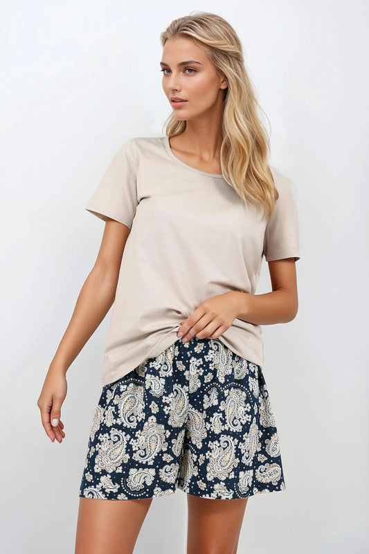 Elegant Luxury Women's OEKO-TEX Certified Pyjama Set by Momenti Per Me featuring a stylish loose top and chic shorts, designed for comfort and aesthetics.