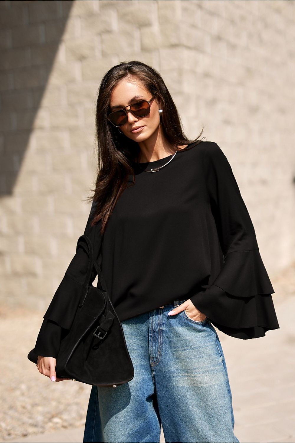 Detail of the Elegant Camila Blouse by Roco Fashion featuring soft flowy sleeves for a sophisticated silhouette.