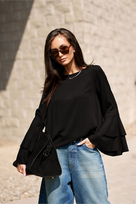 Detail of the Elegant Camila Blouse by Roco Fashion featuring soft flowy sleeves for a sophisticated silhouette.