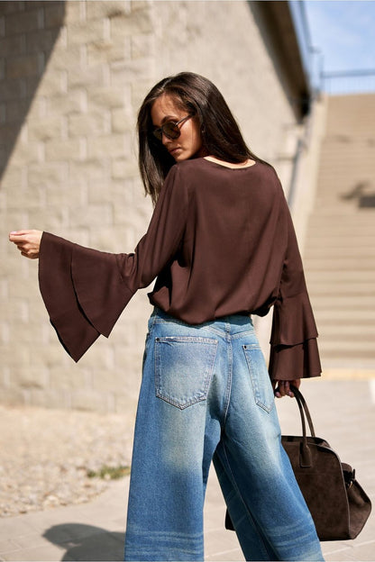 Close-up of the Camila Blouse by Roco Fashion, highlighting the intricate double flounce sleeve detail, a blend of comfort and elegance.