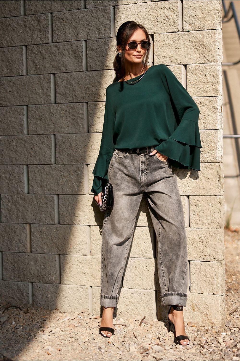 Elegant Camila Blouse by Roco Fashion displayed on a hanger, focus on its lightweight viscose fabric and stylish flounce sleeves.