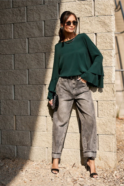 Elegant Camila Blouse by Roco Fashion displayed on a hanger, focus on its lightweight viscose fabric and stylish flounce sleeves.