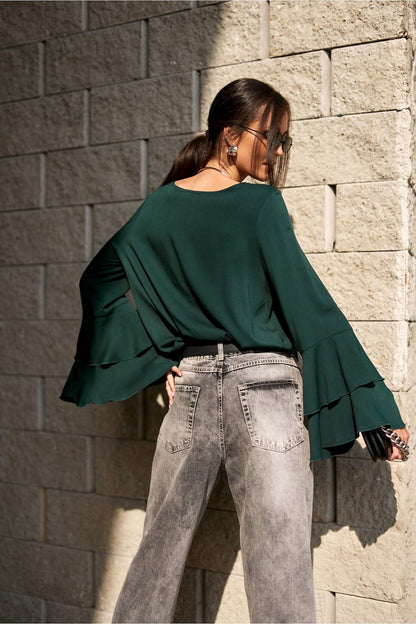 Fashionable arrangement featuring the Camila Blouse by Roco Fashion, ideal for both casual and elegant occasions, made with premium materials.