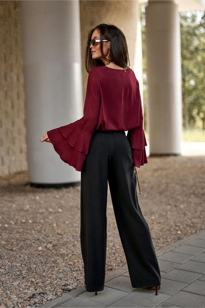 Sophisticated styling of the Camila Blouse by Roco Fashion, elegantly worn with fabric trousers, perfect for formal occasions.