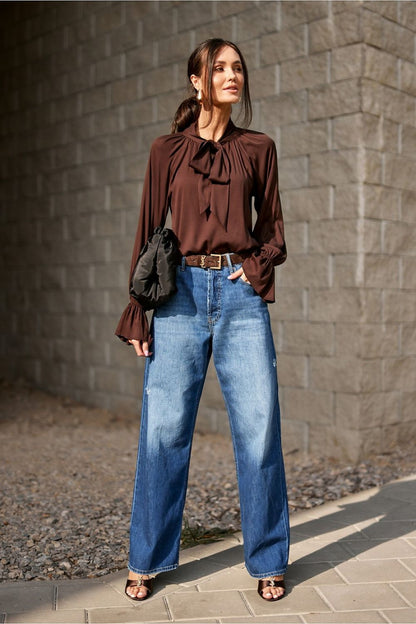 Model wearing the Isabel Elegant Viscose Blouse by Roco Fashion, styled for a chic office look with elegant trousers.