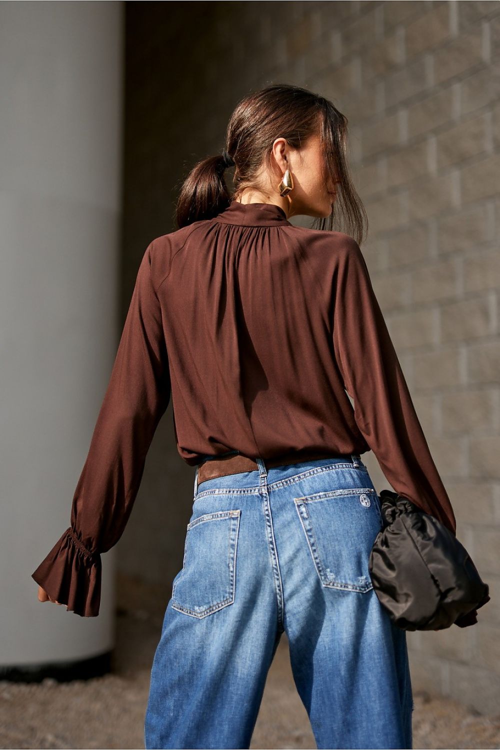 Flat lay of the Isabel Viscose Blouse by Roco Fashion in soft fabric with decorative elements, ideal for modern elegance.