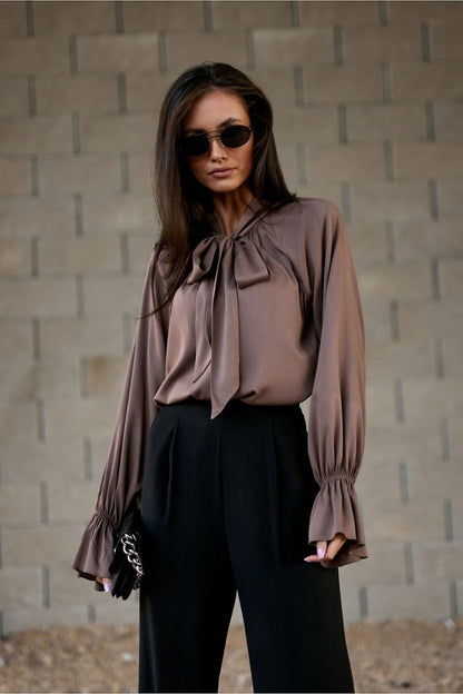 Close-up of Roco Fashion's Isabel Viscose Blouse showcasing the exquisite ruffled cuffs and elegant design elements, ideal for refined office wear.