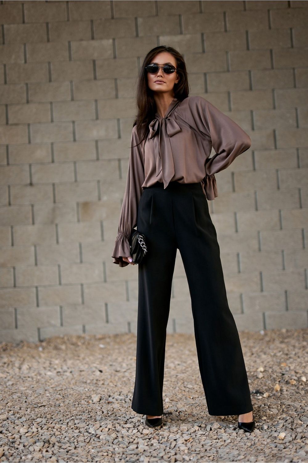 Model wearing Roco Fashion's Isabel Blouse, combining classic elegance and contemporary style, perfect for evening wear with grace and poise.