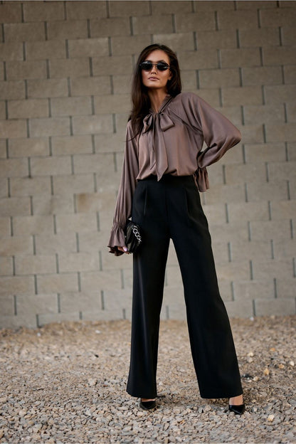 Model wearing Roco Fashion's Isabel Blouse, combining classic elegance and contemporary style, perfect for evening wear with grace and poise.