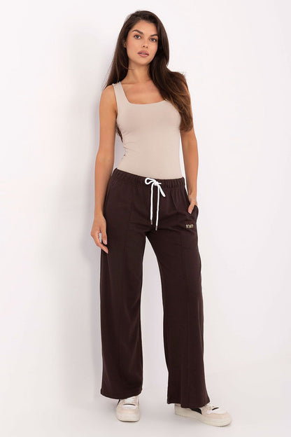 Luxury high waist tracksuit trousers with wide legs from Relevance, crafted from a soft cotton-polyester blend, showcasing a stylish design with a practical drawstring and slip pockets, perfect for elegant casual wear.