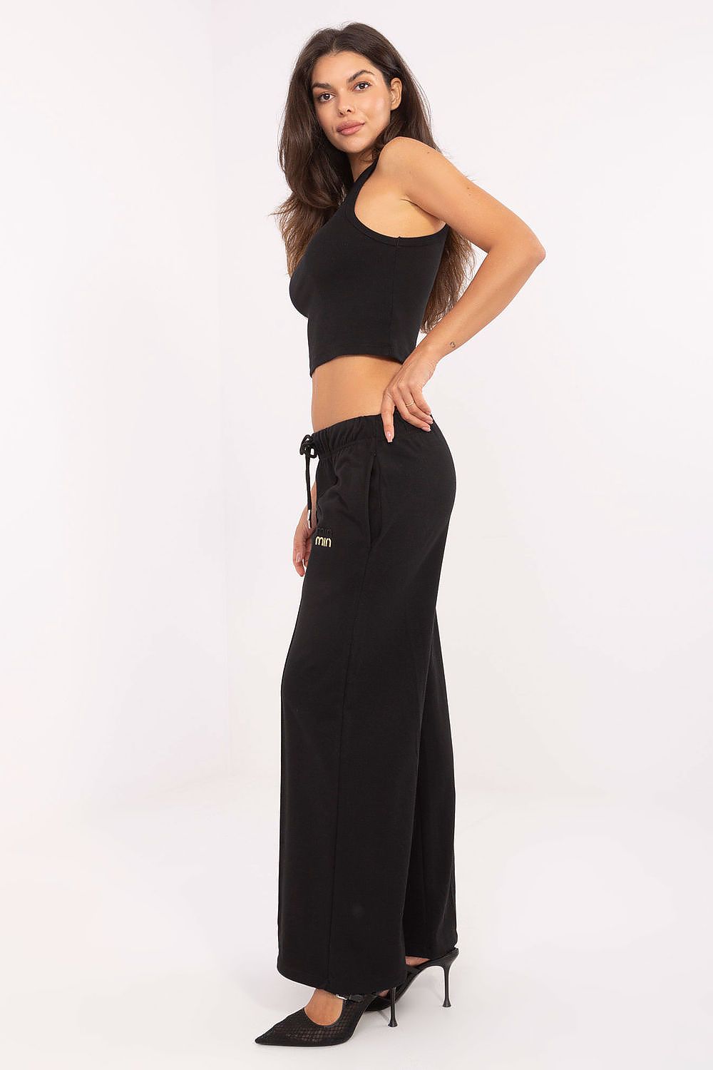 Stylish and functional high waist tracksuit trousers by Relevance, featuring a practical drawstring and slip pockets, ideal for chic everyday wear.