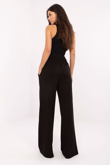 Stylish wide-leg sweatpants with a sophisticated high waist and tie feature by Relevance, made from a premium viscose-polyester blend for a relaxed yet refined look.