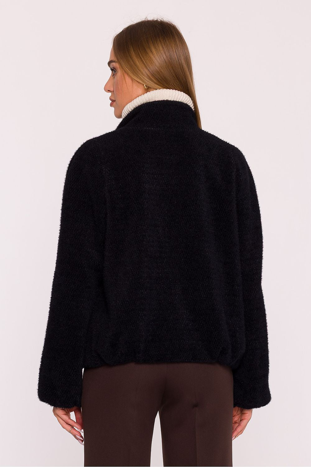 Close-up detail of the luxurious fabric of Moe's women's oversized jacket, showcasing the soft knit texture and modern design.