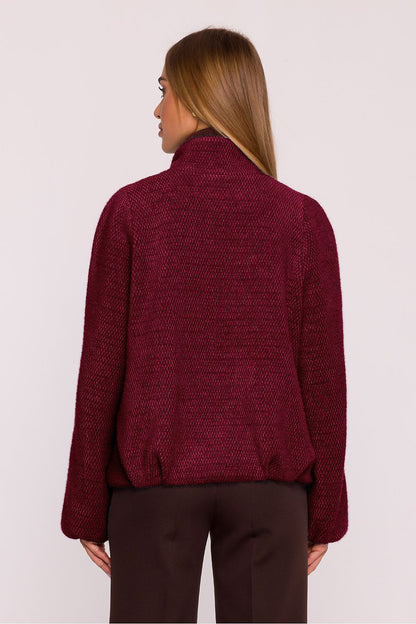 Fashionable women's oversized jacket by Moe displayed with casual attire, illustrating versatility and contemporary sophistication.