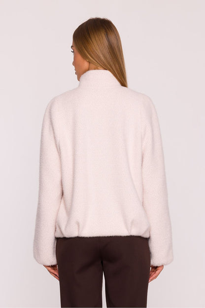 Stylish hip-length women's jacket by Moe, designed in Poland with refined details and a loose fit for ultimate comfort and sophistication.