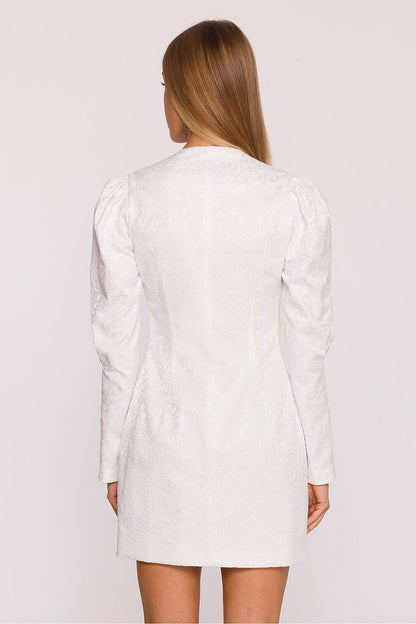 Side view of the Moe Cocktail Dress, emphasizing the sophisticated silhouette with fitted bodice and stylish puff sleeves.
