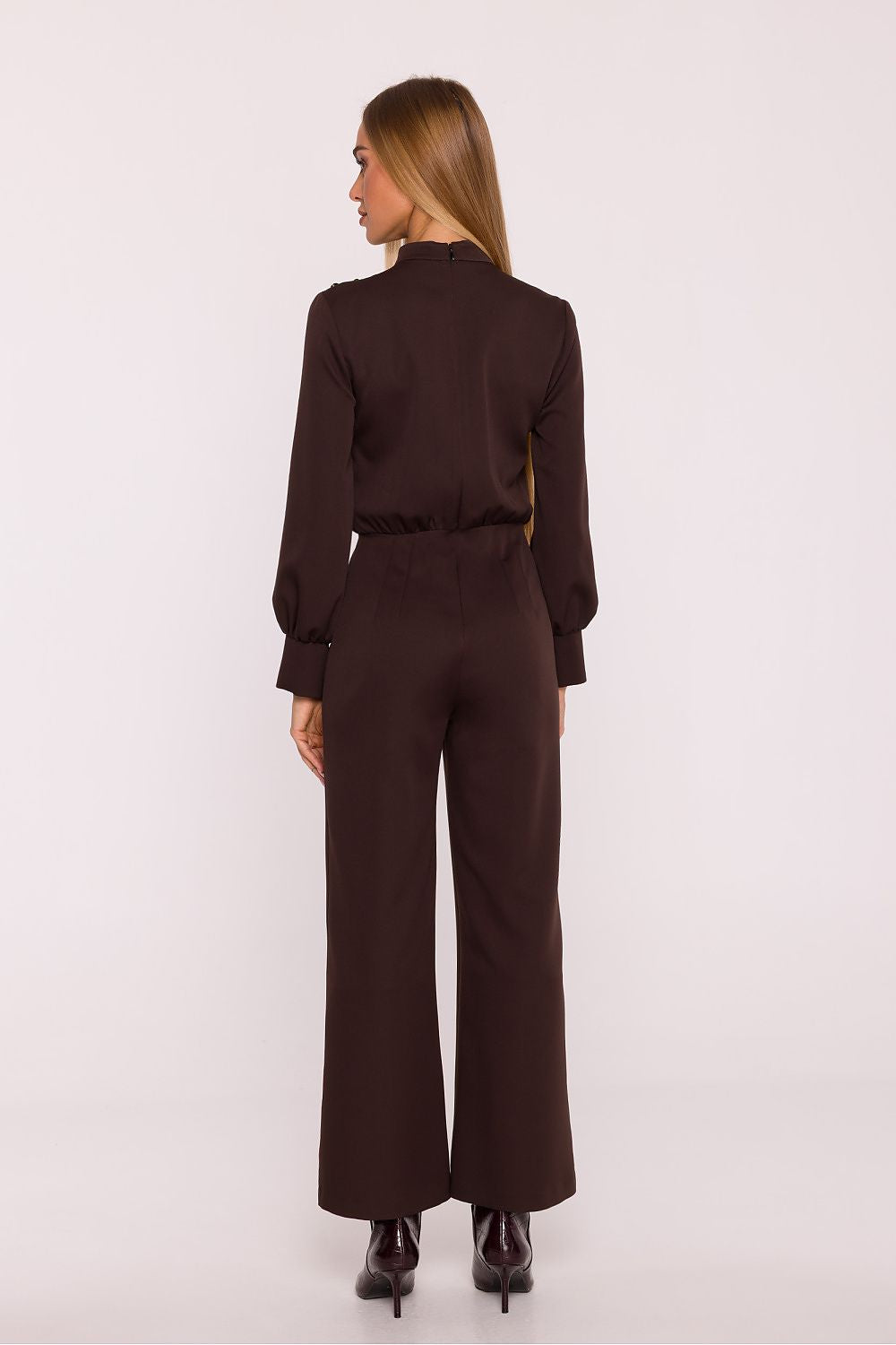 Luxurious jumpsuit design by Moe featuring wide 7/8 length trousers and charming shoulder detailing, epitomising timeless elegance.