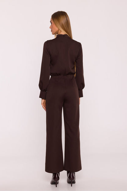 Luxurious jumpsuit design by Moe featuring wide 7/8 length trousers and charming shoulder detailing, epitomising timeless elegance.
