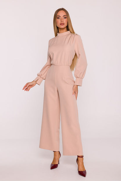 Chic jumpsuit by Moe in elegant smooth fabric, featuring wide cuffs and a concealed back zipper, representing luxury and comfort.