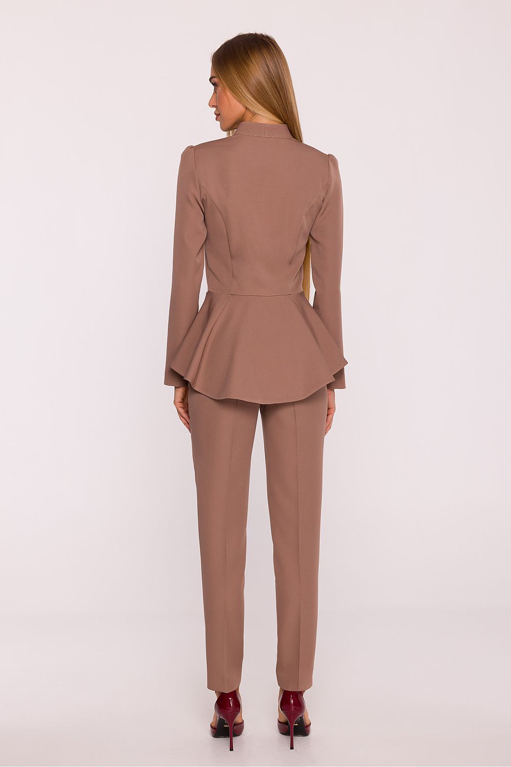 Chic long-sleeve jumpsuit by Moe, showcasing a sophisticated silhouette with a V-neck detail and expertly tailored to accentuate the waist.
