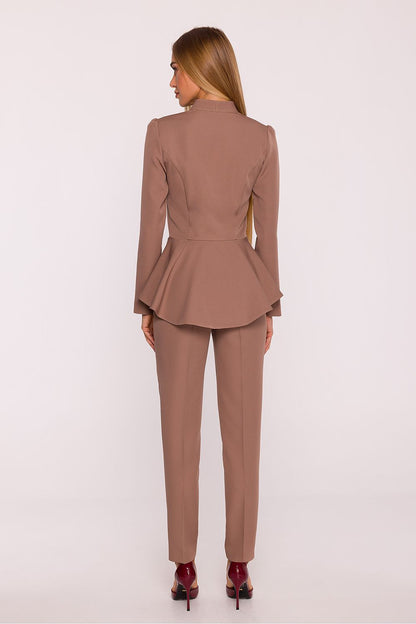 Chic long-sleeve jumpsuit by Moe, showcasing a sophisticated silhouette with a V-neck detail and expertly tailored to accentuate the waist.