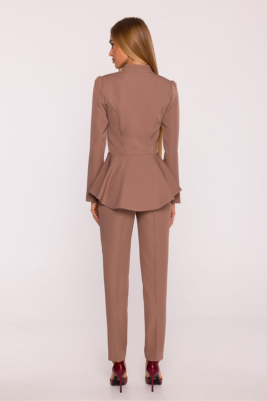Chic long-sleeve jumpsuit by Moe, showcasing a sophisticated silhouette with a V-neck detail and expertly tailored to accentuate the waist.