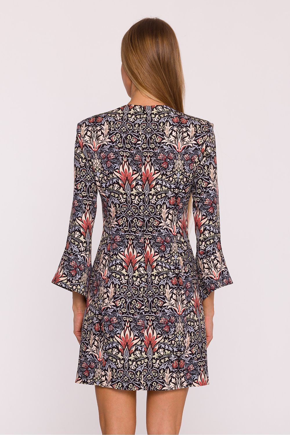 Model wearing Moe Floral V-Neck Daydress, radiating elegance in a mini length dress suitable for both everyday and special occasions.