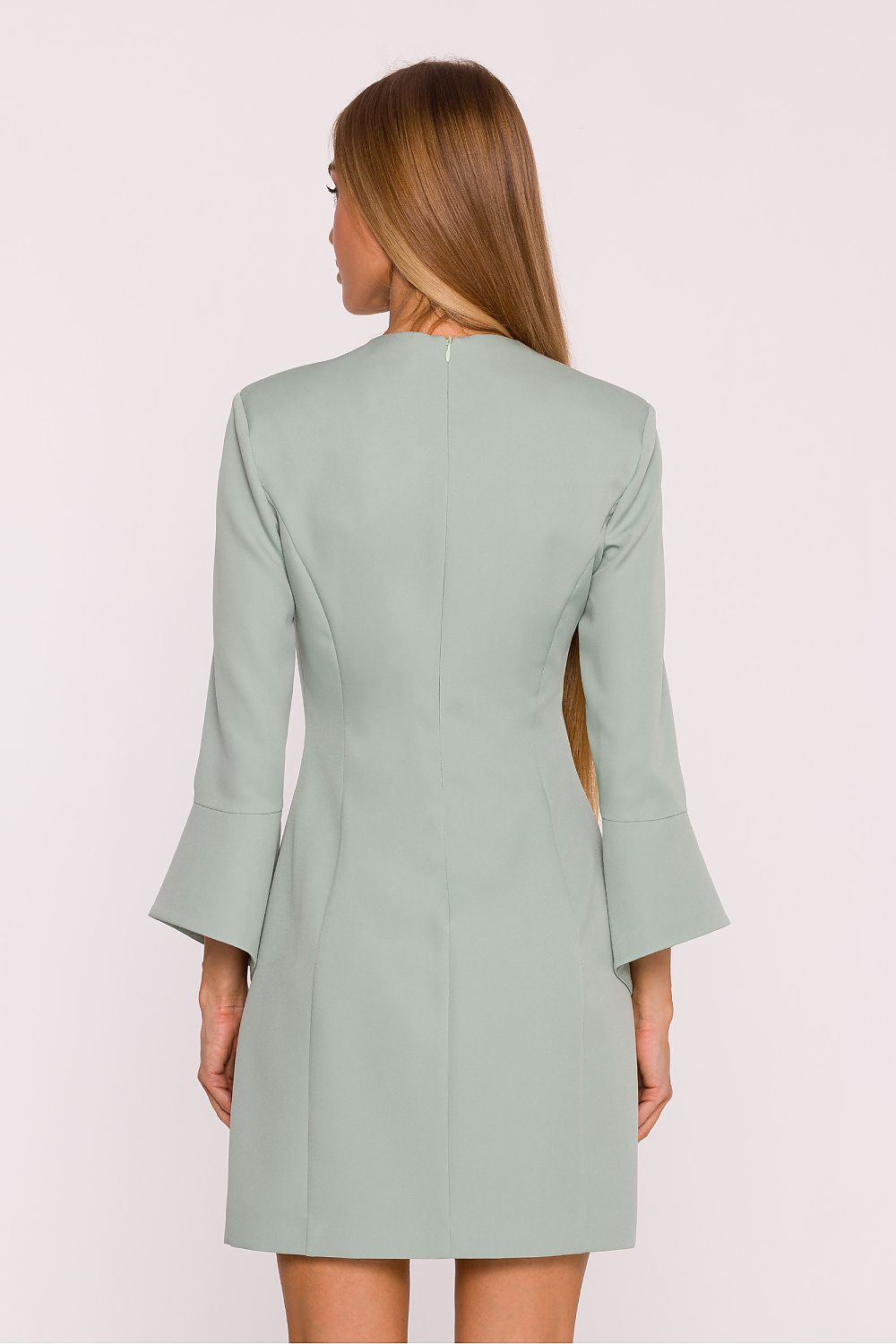 Back view of the Elegant V-Neck Daydress by Moe, featuring a concealed zipper for a sleek finish and a fitted waist accentuated with a luxurious metal logo plate.