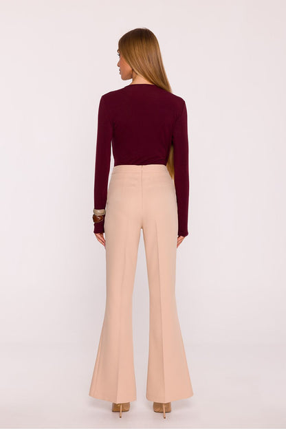 Full view of Moe's women's high-waisted trousers with flared legs, designed to accentuate the waist and elongate the silhouette in a chic, minimalist style.
