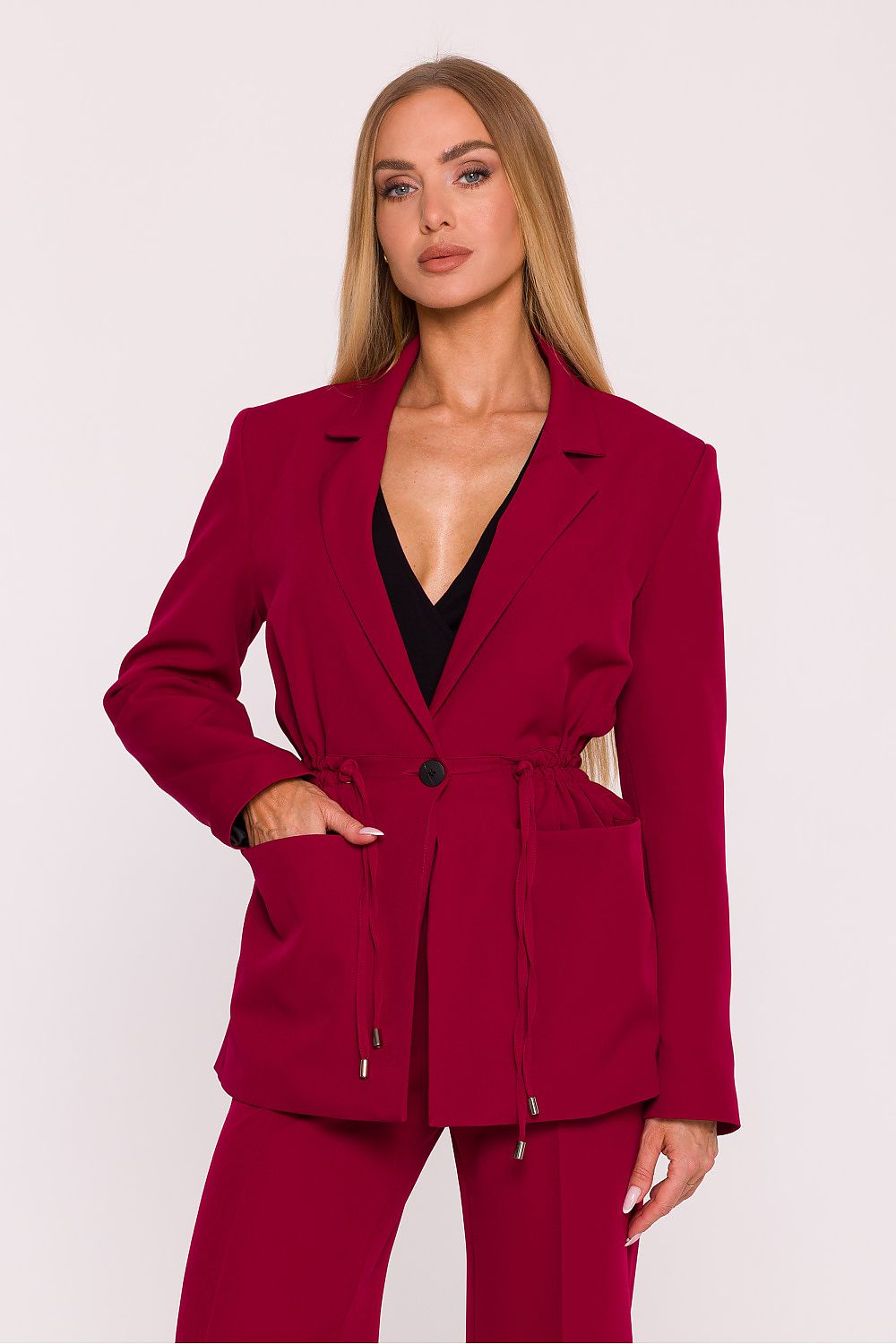 Moe's elegant women's blazer with metal-tipped waist cords, showcasing a sophisticated silhouette with practical patch pockets.