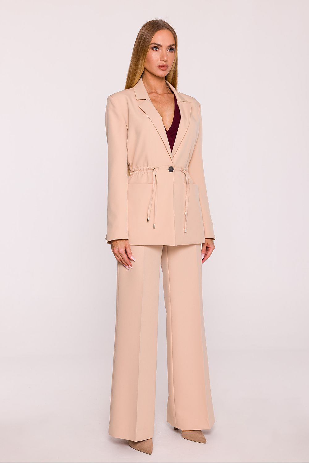 Close-up of Moe's sophisticated women's oversized blazer with smooth fabric and stylish single button closure.